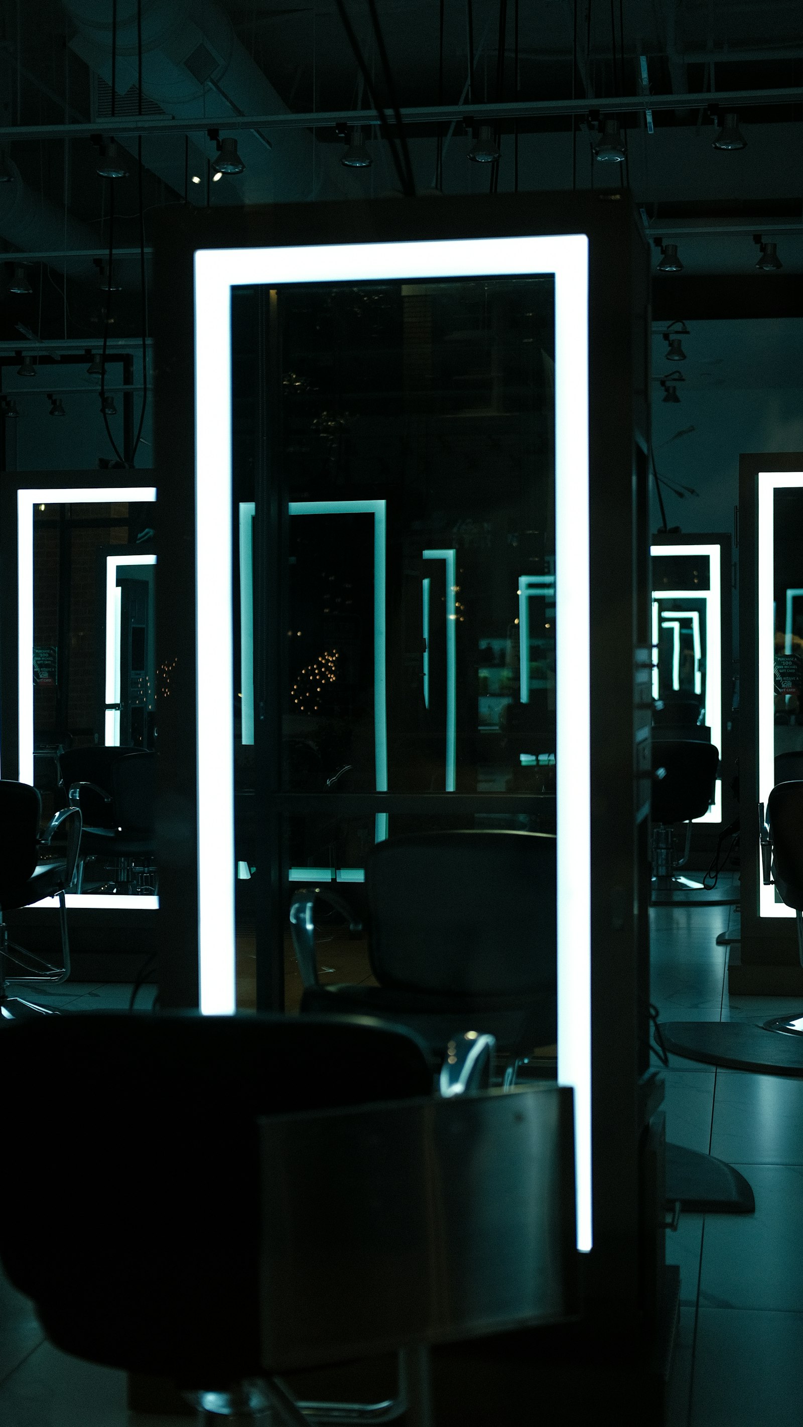 Quiet salon interior with chairs and mirrors