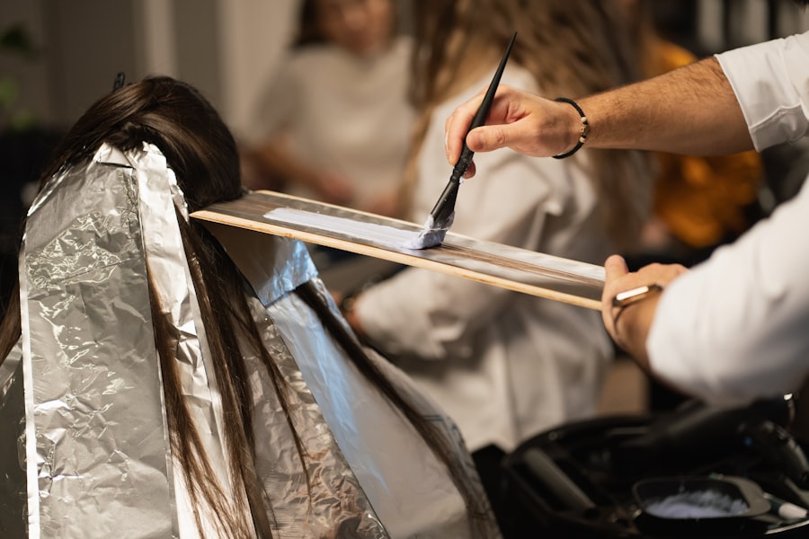 Close detail of a stylist cutting a section of hair
